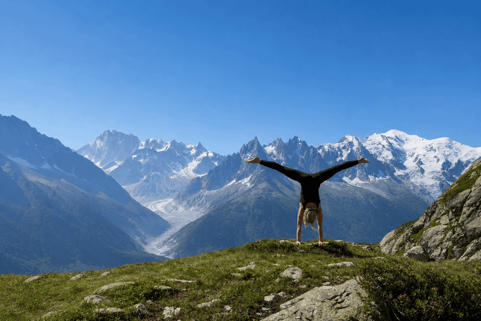 Henriette Aluma Nedergaard holding a handstand in the mountains above Chamonix
